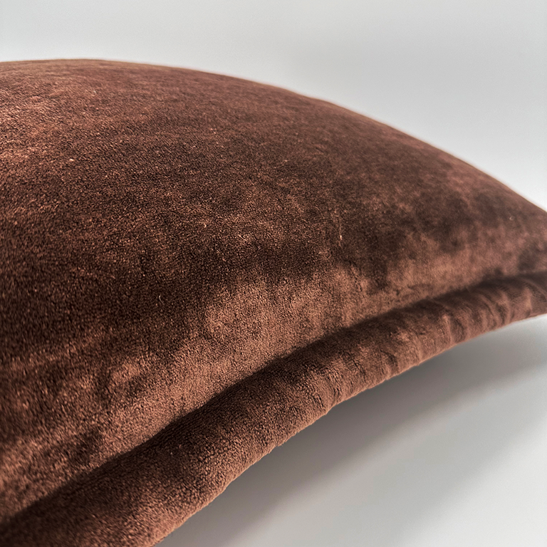 Brown textured cushion on a white background