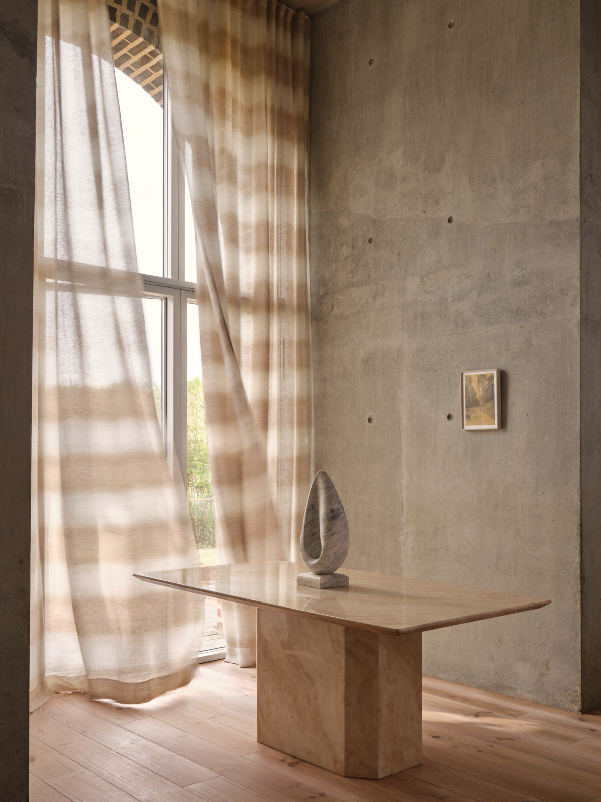 Mirage Haze fabric by de Le Cuona draped in a neutral-toned, elegant interior setting.
