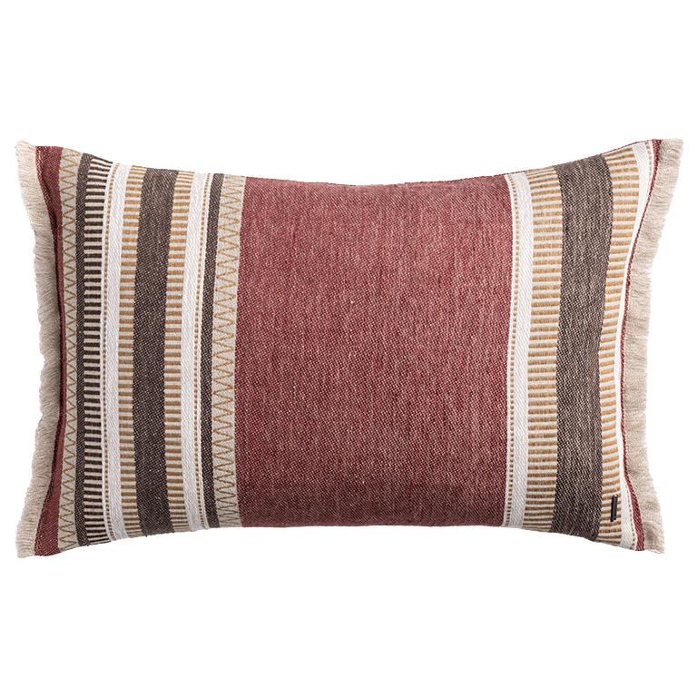 Rust red linen cushion with embroidered stripe detailing, textured woven fabric and natural linen trim